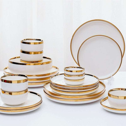 a table topped with white plates and cups
