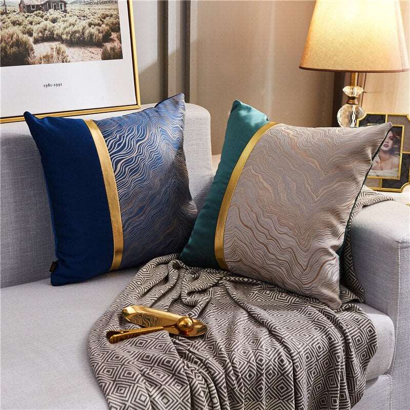 a couch with pillows and a blanket on it