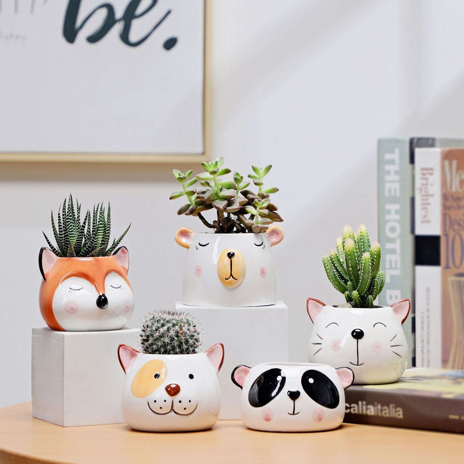 a group of stuffed animals sitting on top of a table