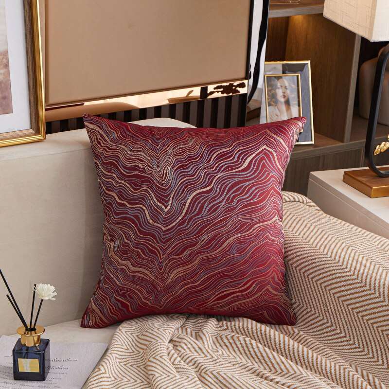 a bed with a red blanket on top of it