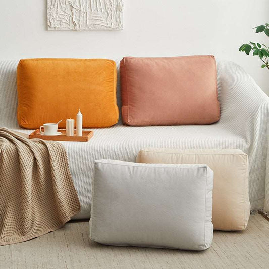 a living room with a couch and pillows