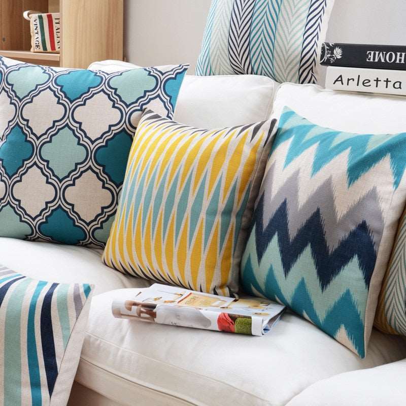 a bed with a blanket and pillows on it