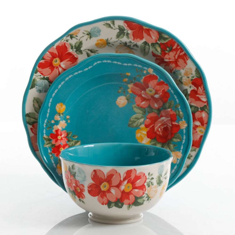 a close up of a vase with flowers on it