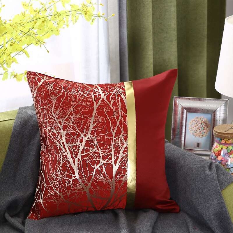 a red couch with a red pillow on it
