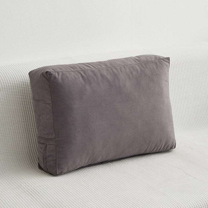 a large black couch sitting on top of a white floor
