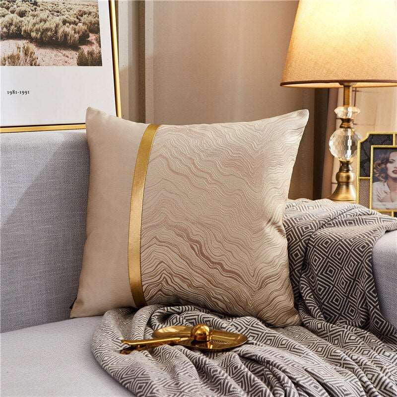 a bed that has a blanket and pillows on it