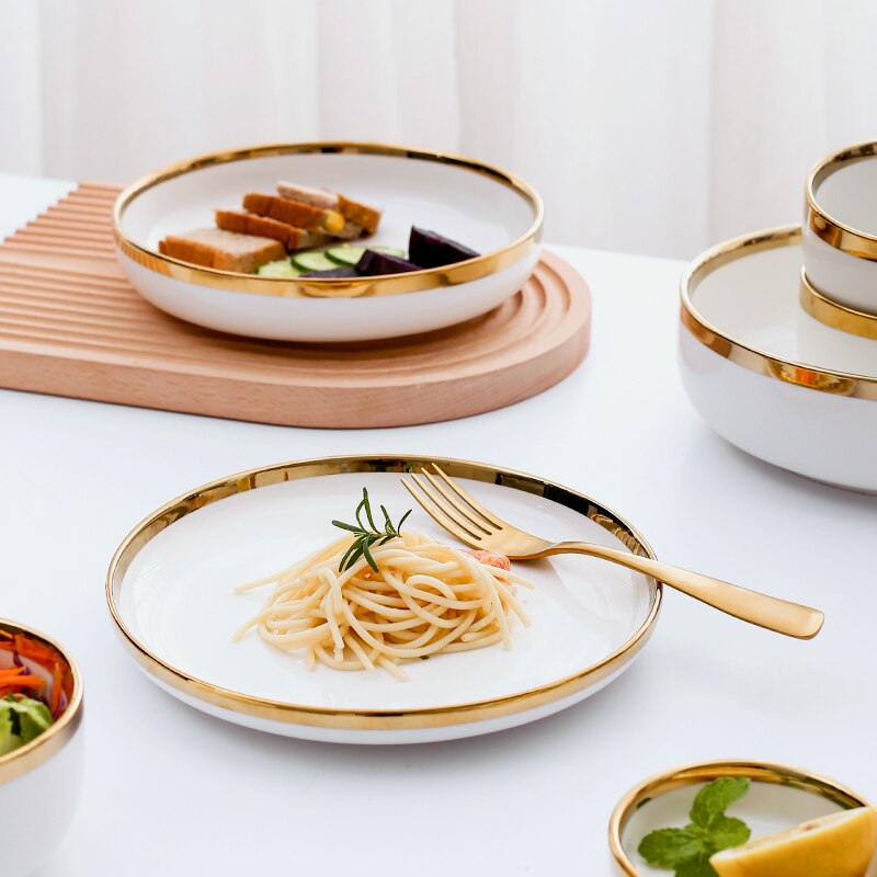 a table topped with plates of food and bowls of food