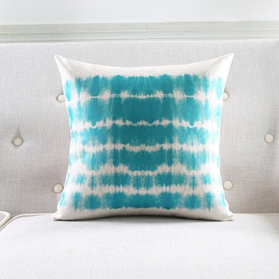 a bed that has a blanket on it
