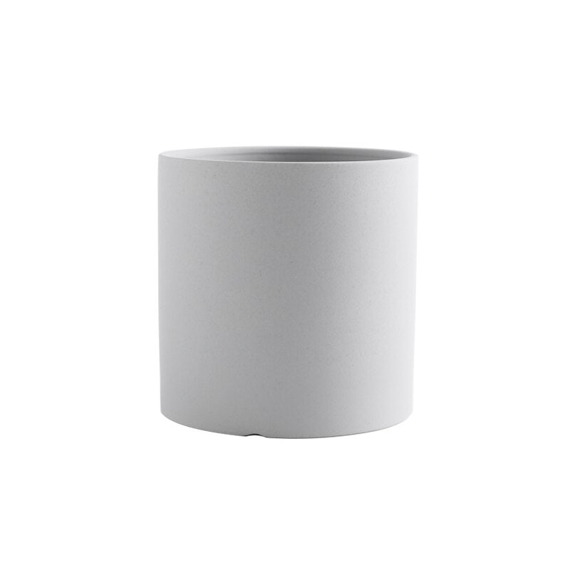 a white cup sitting on top of a table