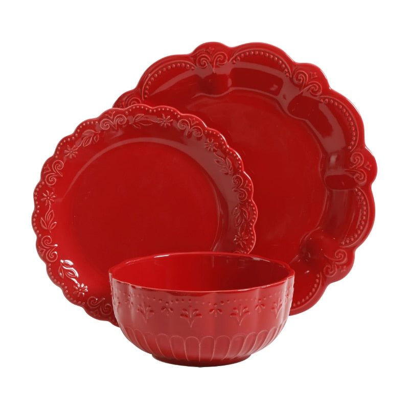 a red cup is sitting on a table