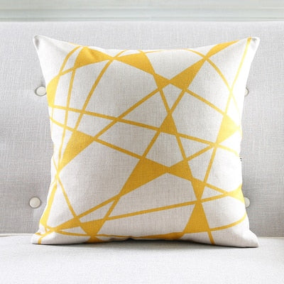 a yellow umbrella sitting on top of a white surface