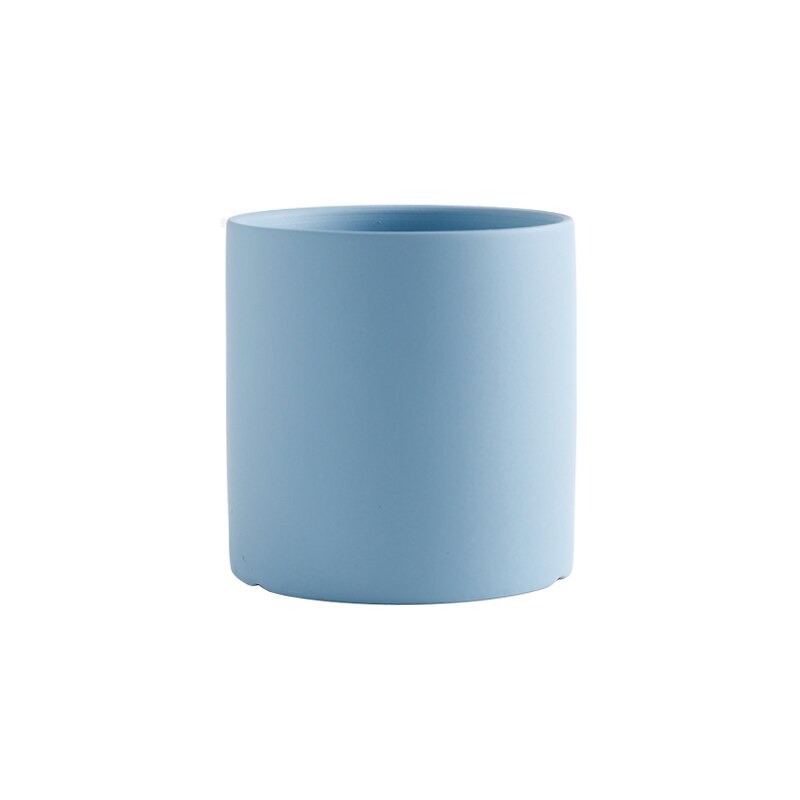 a white cup sitting on top of a table