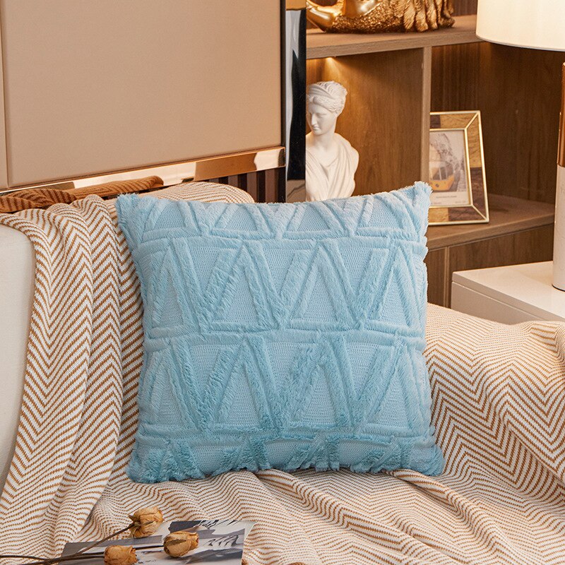 a bed that has a blue blanket on it