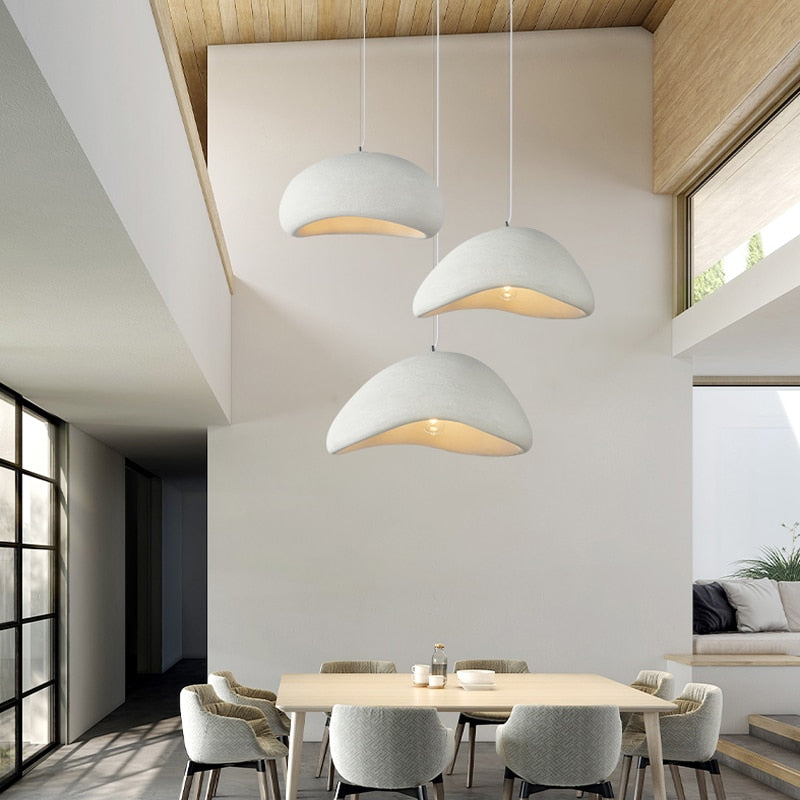 a couple of white chairs in a room
