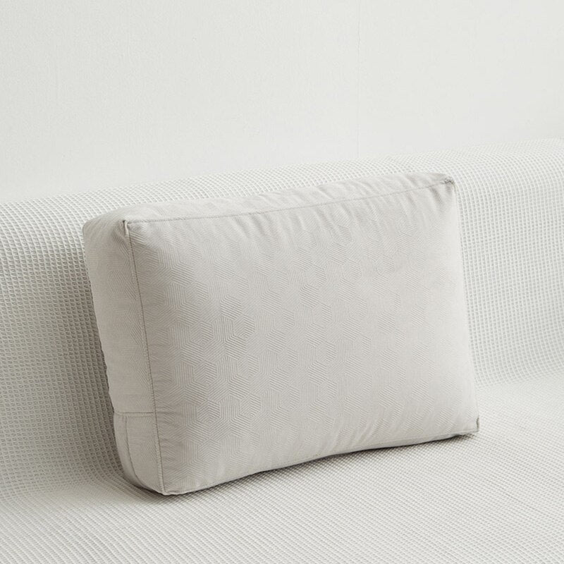 a white bed with a white blanket on top of it
