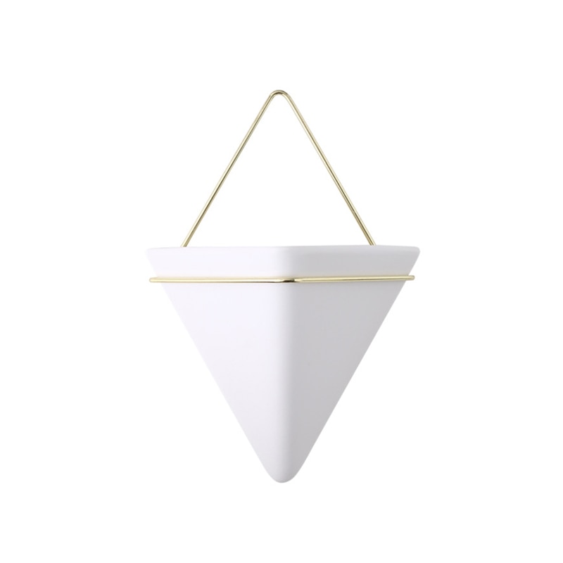 a white umbrella is in a white vase