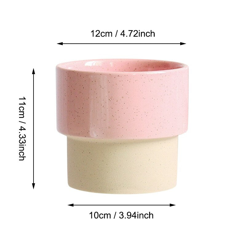 a pink cup filled with a pink flower