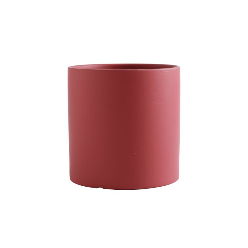 a red cup is sitting on a table