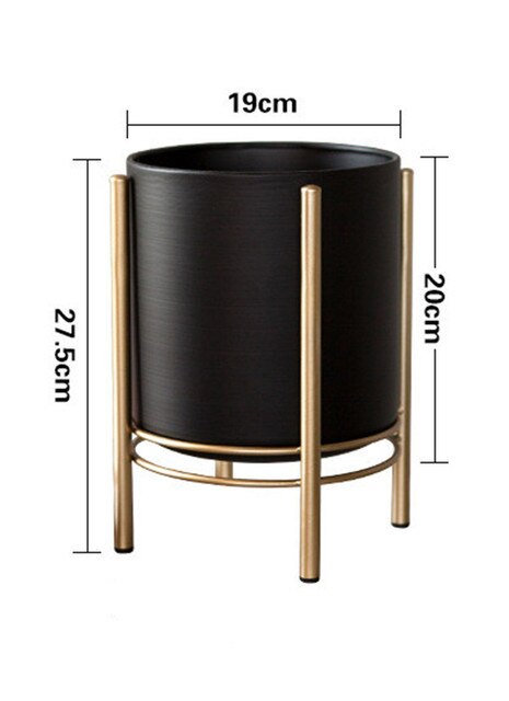 a black chair sitting next to a black refrigerator