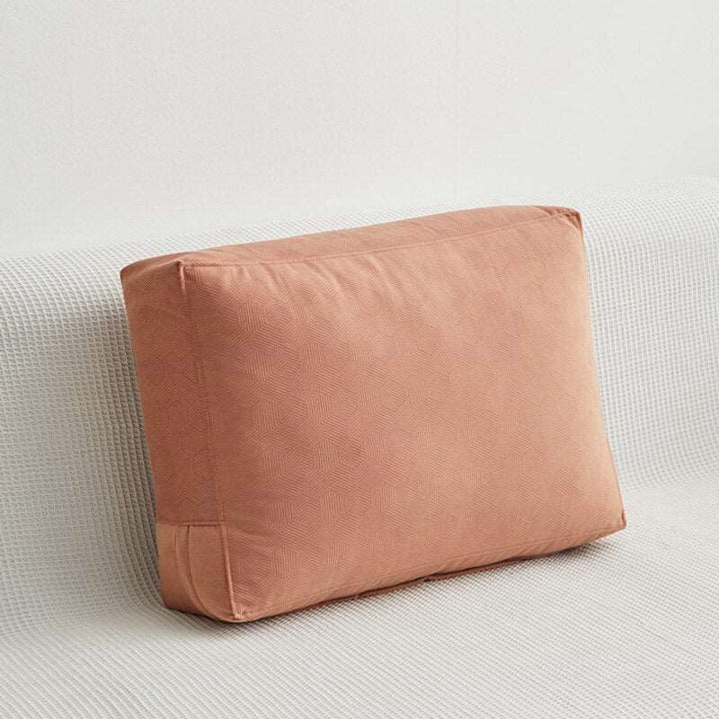 a brown couch sitting on top of a white surface 