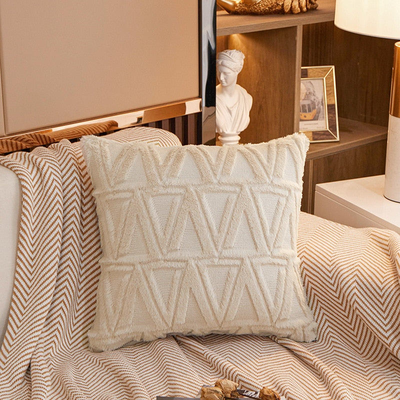 a bed with white sheets and pillows in a room 