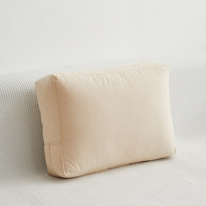 a white pillow sitting on top of a white pillow 