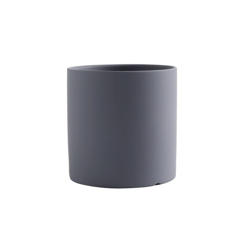 a white cup sitting on top of a table 